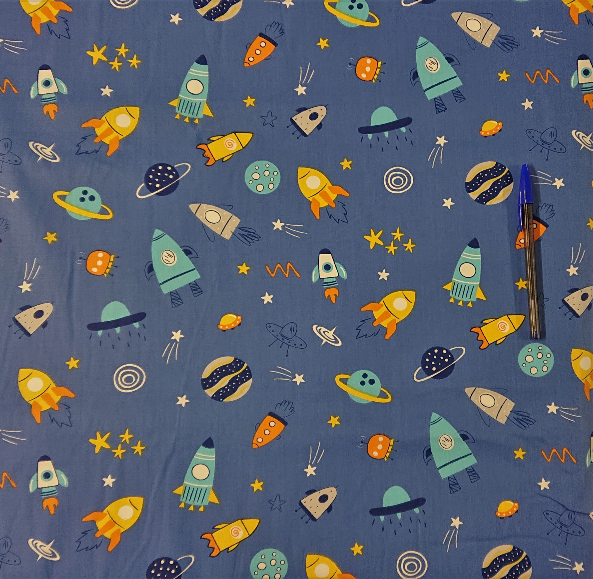 Fabrics 100 COTTON EXCLUSIVE PRINTS. Space Rockets Blue. 100